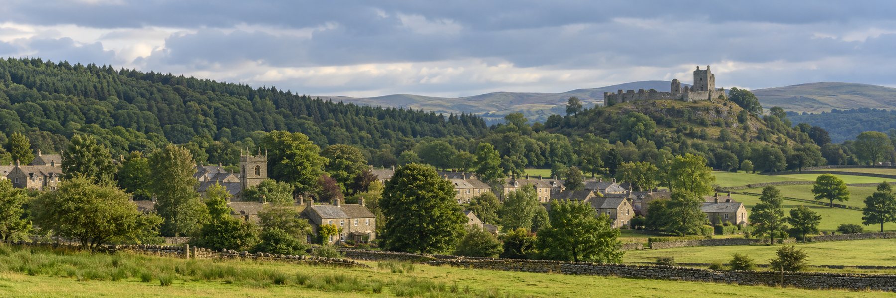 Argleton village, woodland and the ruined castle on the hill